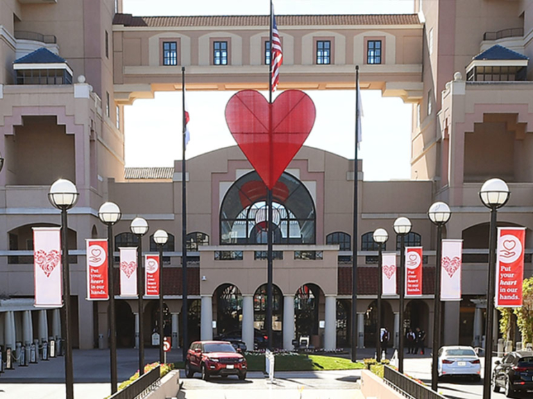 Huntington Hospital entrance with large red heart sculpture and heart health banners