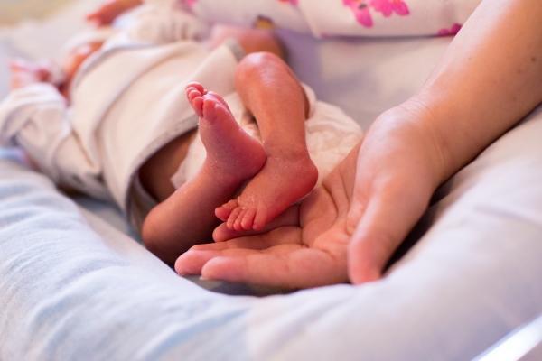 Mother Holding Baby Feet