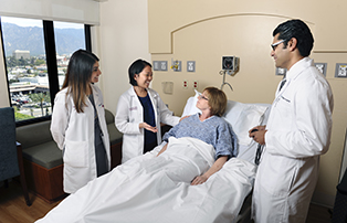 gme residents standing around a patient