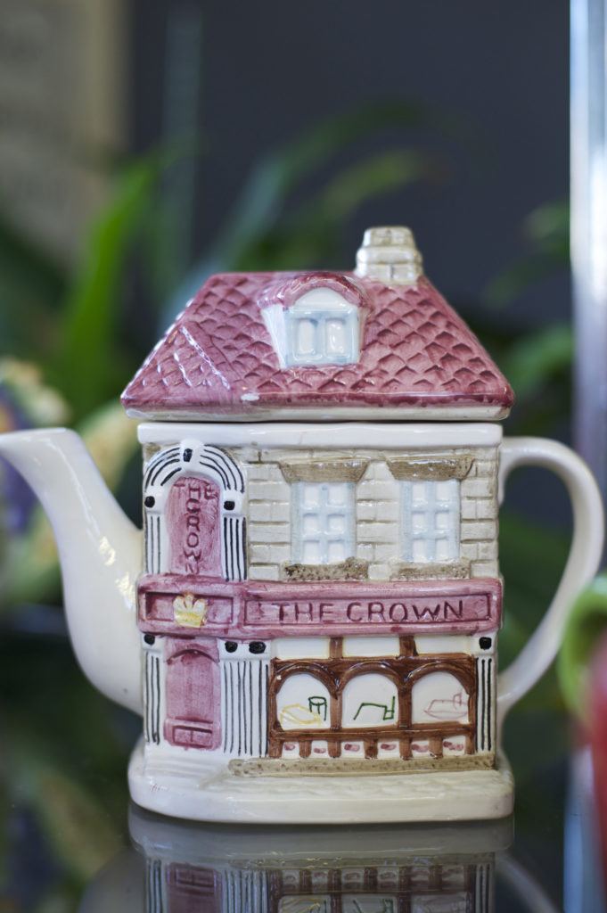 mug designed like a building with a spout
