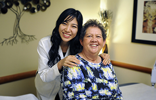a doctor smiling with a patient
