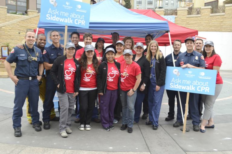 Huntington Hospital volunteers and first responders at outdoor Sidewalk CPR community awareness event