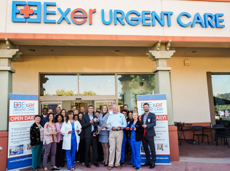 Exer Urgent Care grand opening ribbon cutting ceremony with medical staff and community members