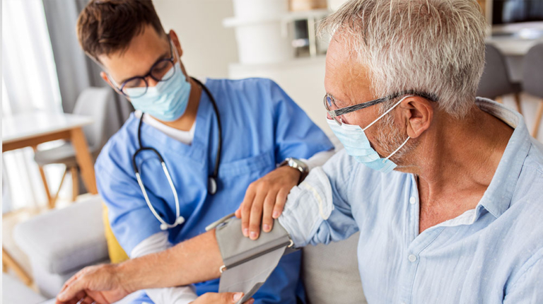 Doctor checks blood pressure of patient