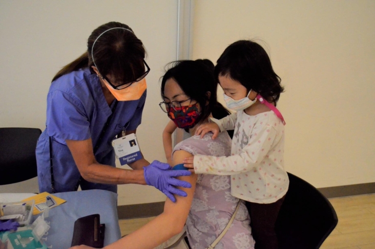 Patient and daughter getting flu shots
