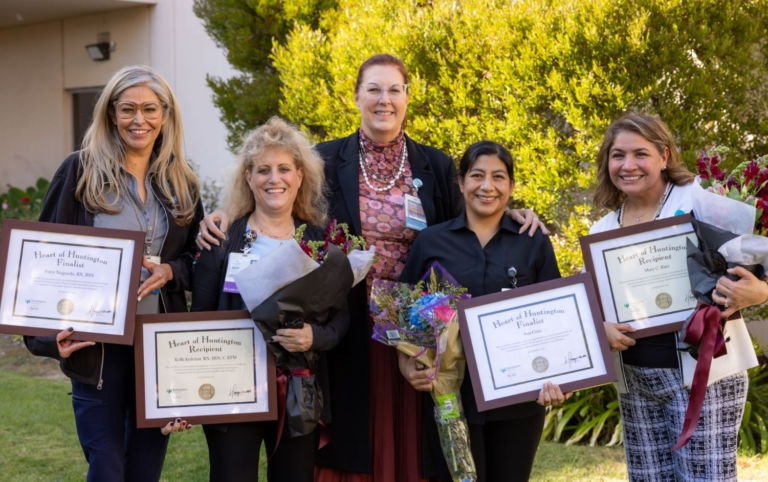 Heart of Huntington group picture with winners smiling holding awards and flowers