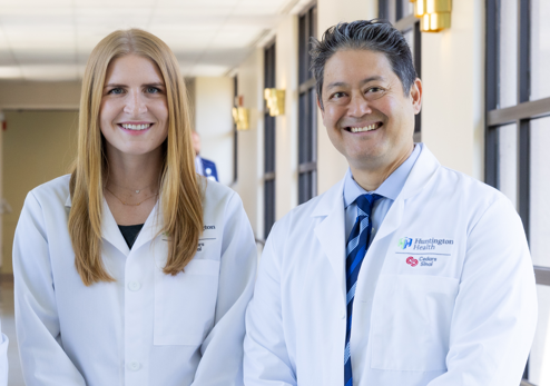 Two doctors standing in a hallway