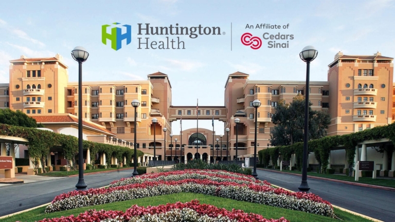 Huntington Health exterior with flower garden and Cedars Sinai affiliation logo